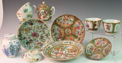 many different types of porcelain dishes and bowls on display