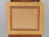 an old wooden picture frame with a picture in it on top of a table