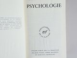 an open book with a black and white image of a person ' s hand holding an open book