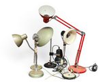 a lot of different types of lamps that are on the table