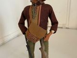 figurine of a man with a hat and a gun