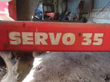 a red sign that says servo 35 on the side of a truck