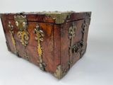 an old wooden box with brass hardware on the top