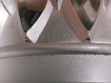 a close up of a metal object with a crown on top of it