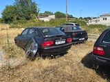 two cars parked next to each other on the side of the road