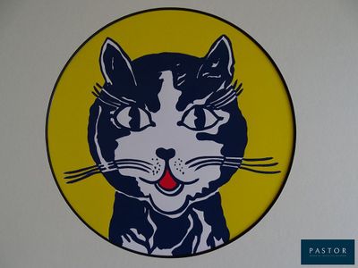 a picture of a black and white cat with a yellow background
