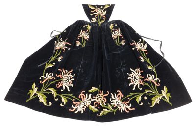 a black dress with a floral design on it