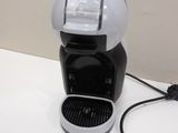 a coffee maker that is sitting on a table