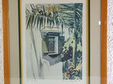 painting of a window and palm tree in a frame on a wall