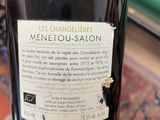 a bottle of wine that is sitting on a table