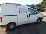 a white van that is parked in a parking lot