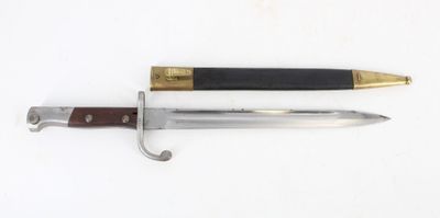 an image of a knife and a pen on a white surface