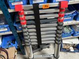 a picture of a rack of tools in a garage