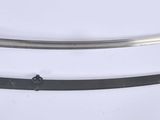 a close up of two swords on a white surface