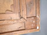 a wooden door with a hole in the middle of it