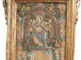 an image of a gold frame with a picture of a woman on it