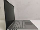 a laptop that is sitting on a white table