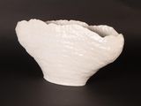 a white bowl that is sitting on a table