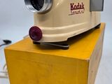 a yellow box with a camera on top of it