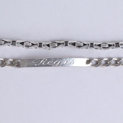 pair of silver plated bracelets with the word fight engraved on them