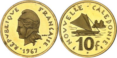 a close up of a coin with a boat on it