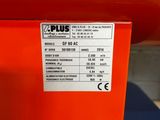a close up of a red box with a price label on it