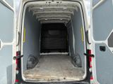 a white van with the door open in the back of it