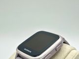 a smart watch that is sitting on top of a bag