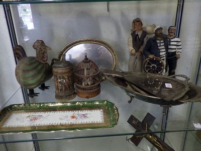 a glass display case with a lot of items on it