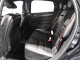 a black car with red trims and black seats