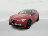 a red alfa car parked in a white room