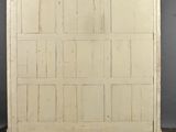 an old white wooden door is sitting on top of a table