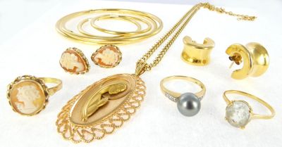 a lot of jewelry that is laying out on a white surface