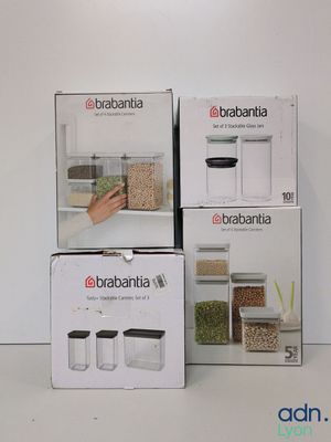 three boxes of food are stacked on top of each other on a white surface