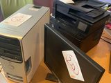 two computers and a printer sitting on a desk