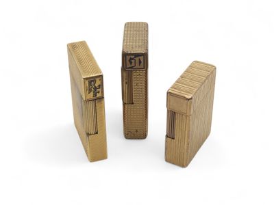 three wooden lighters sitting next to each other on a white surface