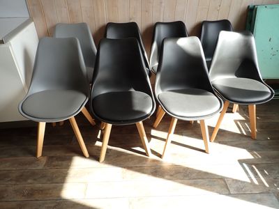 six chairs lined up in a row in a room