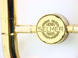 a close up of a brass instrument with a label on it