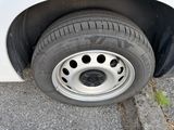 a close up of a tire on the side of the road