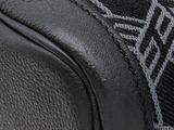 a close up of a black and white bag with a pattern on it