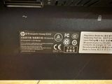 the back side of a laptop with a label on it