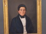 portrait of a man in a blue jacket and white shirt