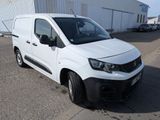 a picture of a white van parked in front of a building