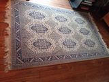 a rug on the floor in a living room