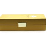 an image of a gold box that is open on a white surface