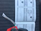 a picture of a car seat with a bunch of keys attached to it