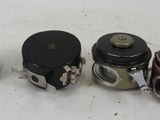 four different types of valves are lined up on a white surface