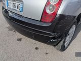 a car that has been damaged and is parked in a parking lot
