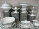 a lot of plates and bowls that are stacked together