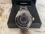 a close up of a watch in a box on a table